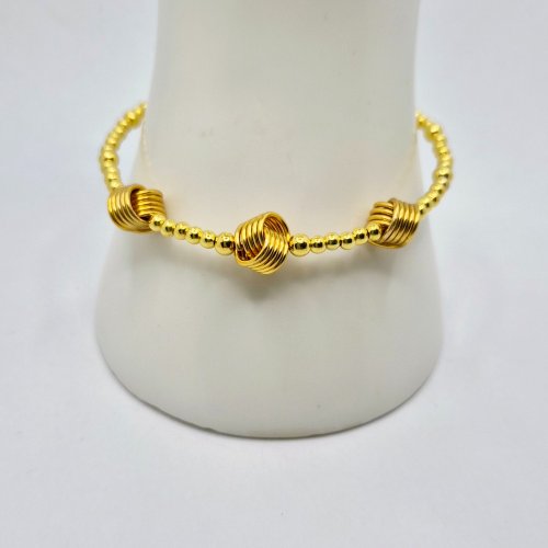 Natalie Patten's Love Knot Bead Components  - , Contemporary Wire Jewelry, Coiling, Coiling Wire, Wire Coiling, Love Knot Bead on bracelet